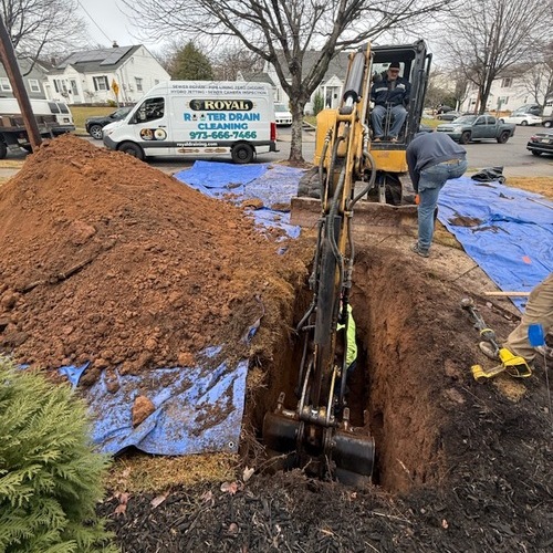 Plumbers work on sewer line