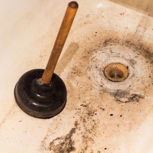A clogged drain in the bathroom